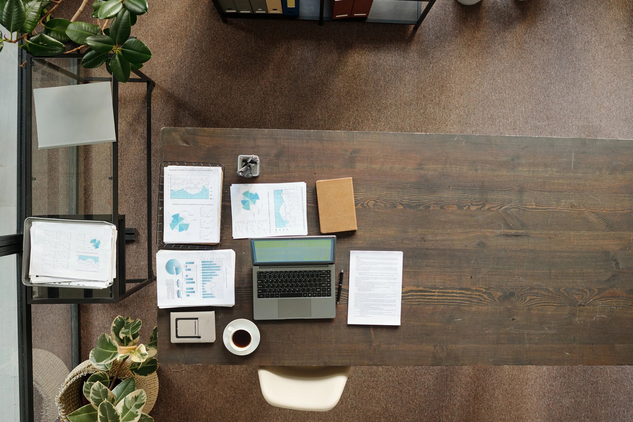 Laptop and printed documents on a desk